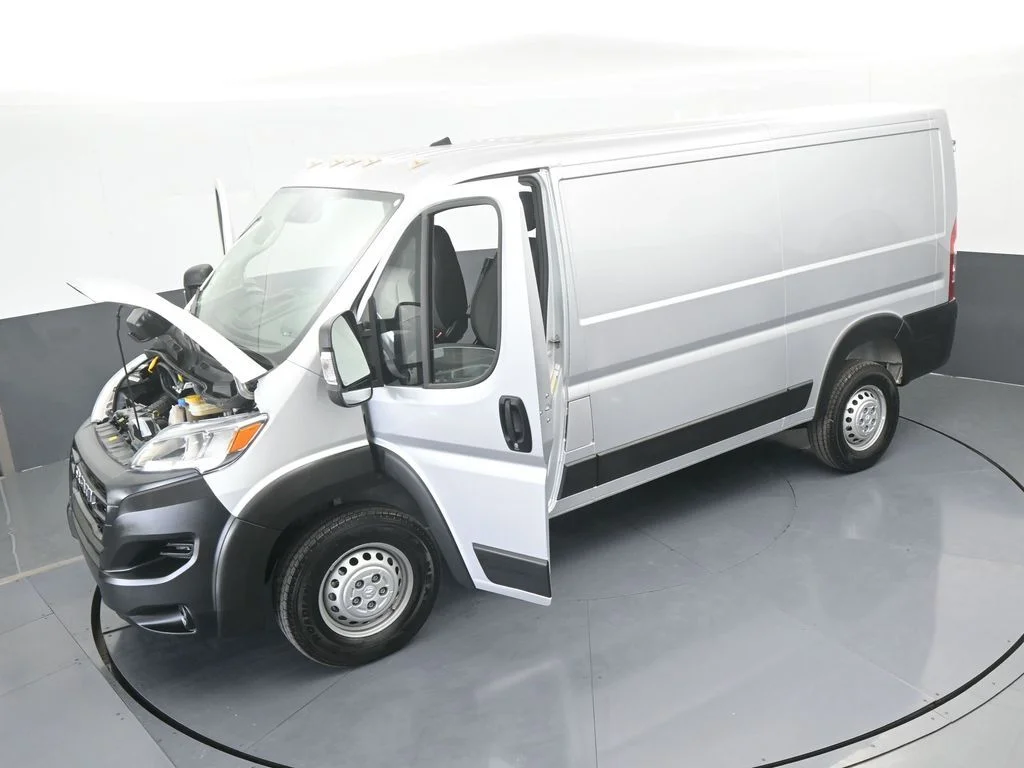 Used 2025 Bright Silver Clearcoat Metallic Ram Low Roof image 55