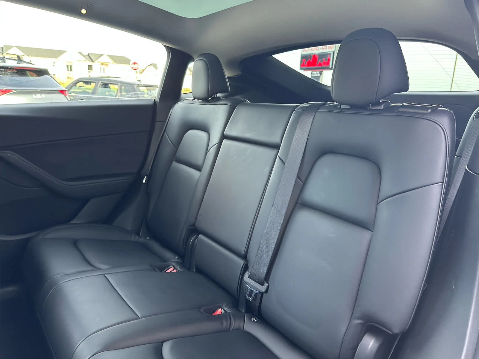 Used 2022 Solid Black Tesla Performance image 9