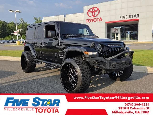 Used 2020 Black Jeep Unlimited Sahara image 1