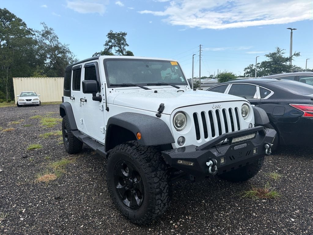 Used 2017 White Jeep Unlimited Sport image 1