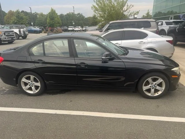 Used 2015 Black BMW 328i xDrive image 1