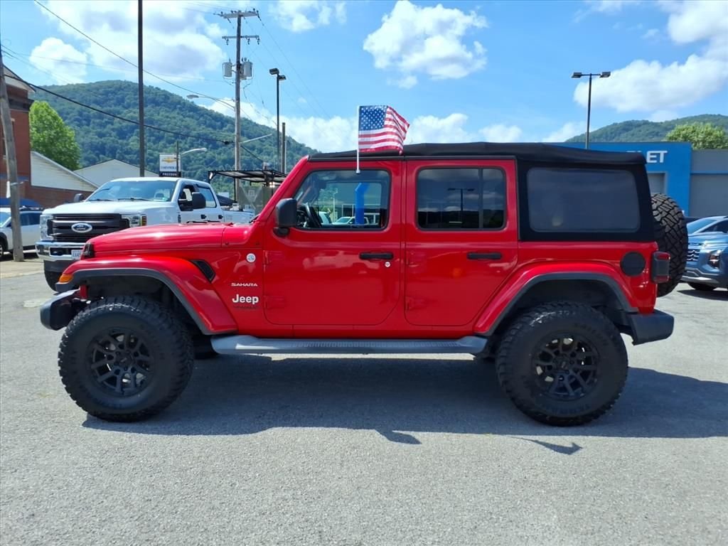 Used 2018 Red Jeep Unlimited Sahara image 2