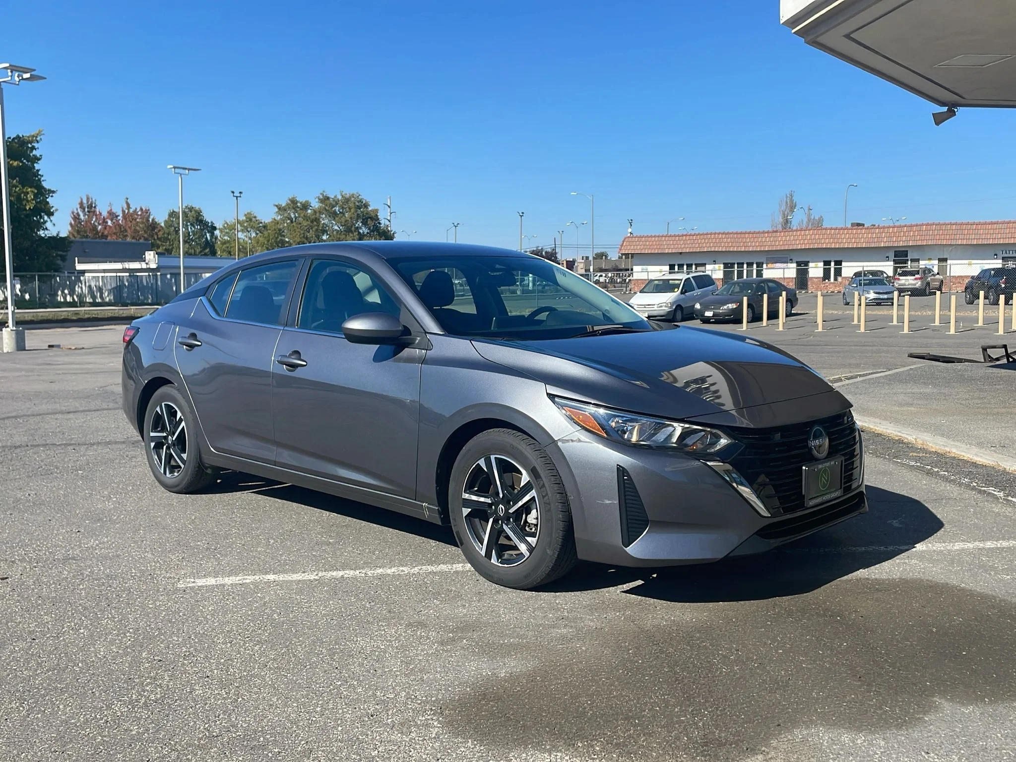 Used 2024 Gun Metallic Nissan SV image 1