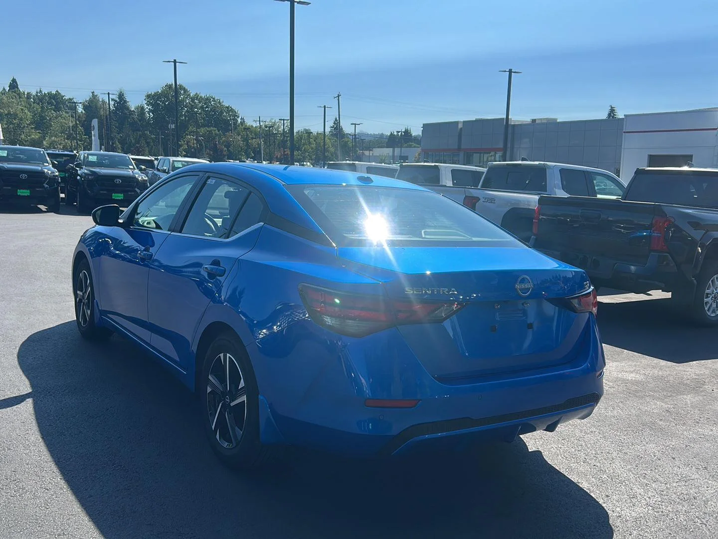 Used 2024 Electric Blue Metallic Nissan SV image 2