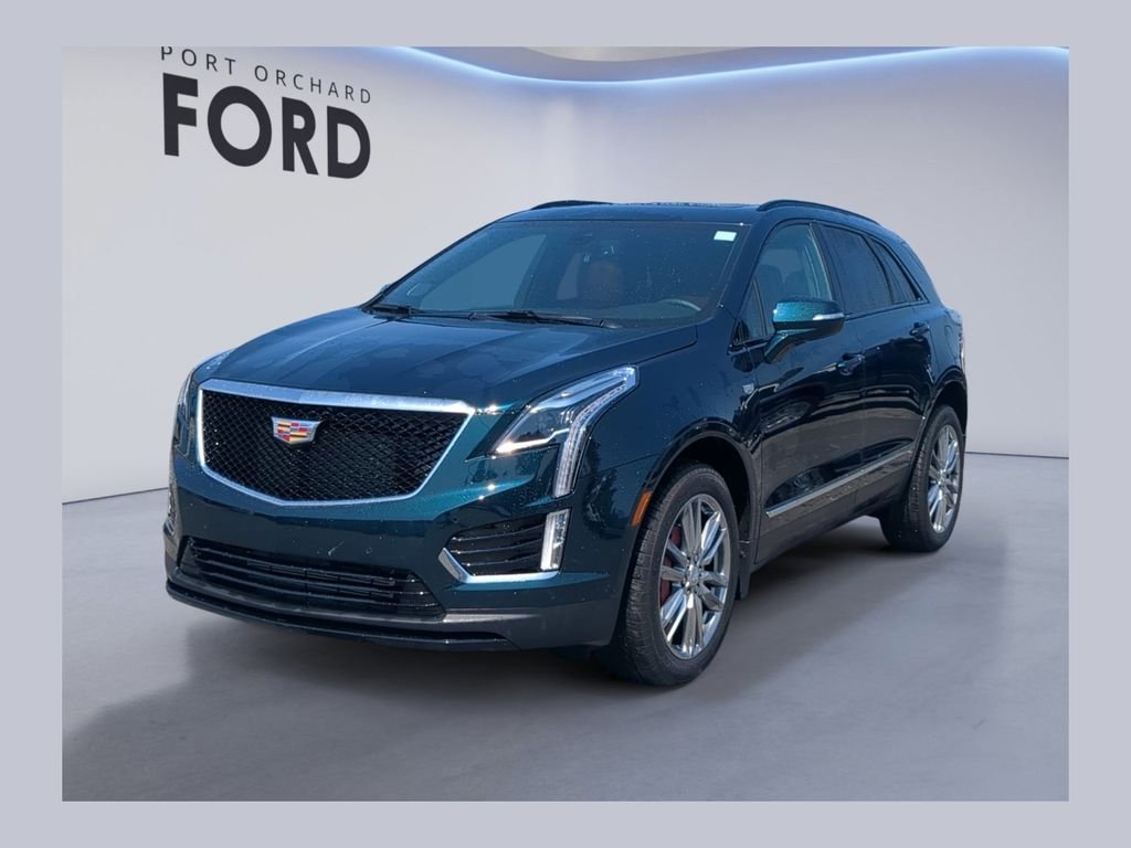 Used 2025 Blue Cadillac Sport image 1