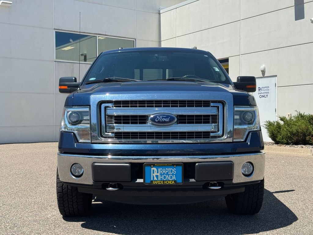 Used 2014 Ford F-150 XLT with VIN 1FTFW1EF7EKG49236 for sale in Coon Rapids, Minnesota