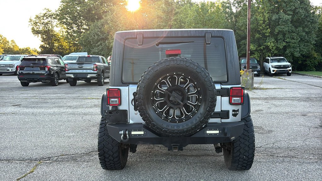 Used 2013 Billet Clearcoat Metallic Jeep Unlimited Sport image 24