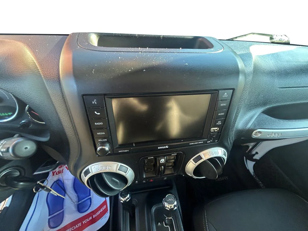 Used 2018 Bright White Jeep Unlimited Sahara 4x4 image 11
