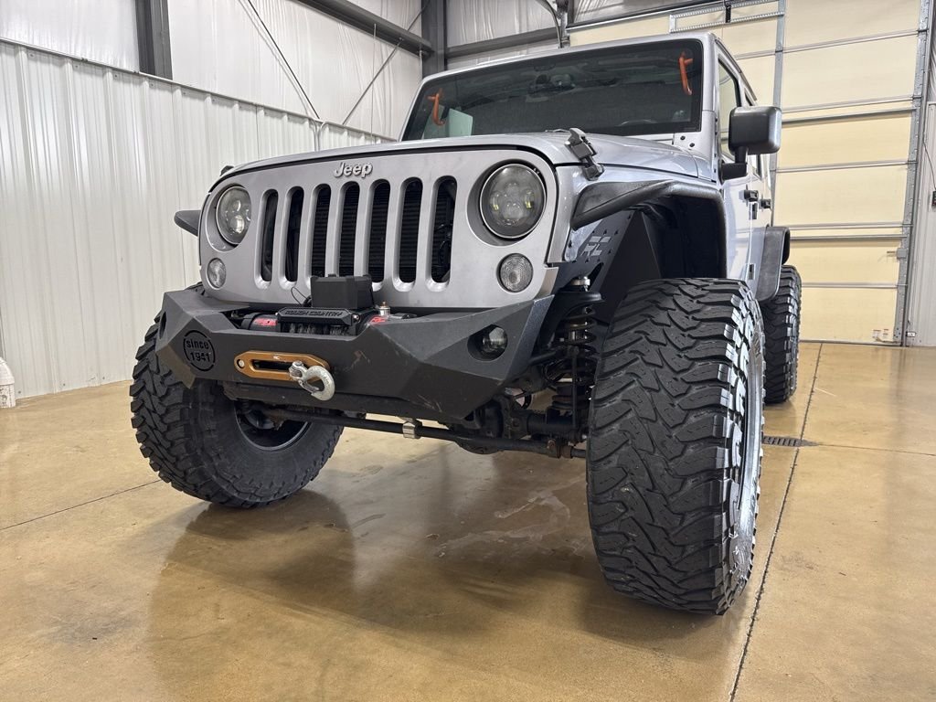 Used 2014 Jeep Wrangler Unlimited Sahara with VIN 1C4BJWEG4EL138872 for sale in Carlyle, IL