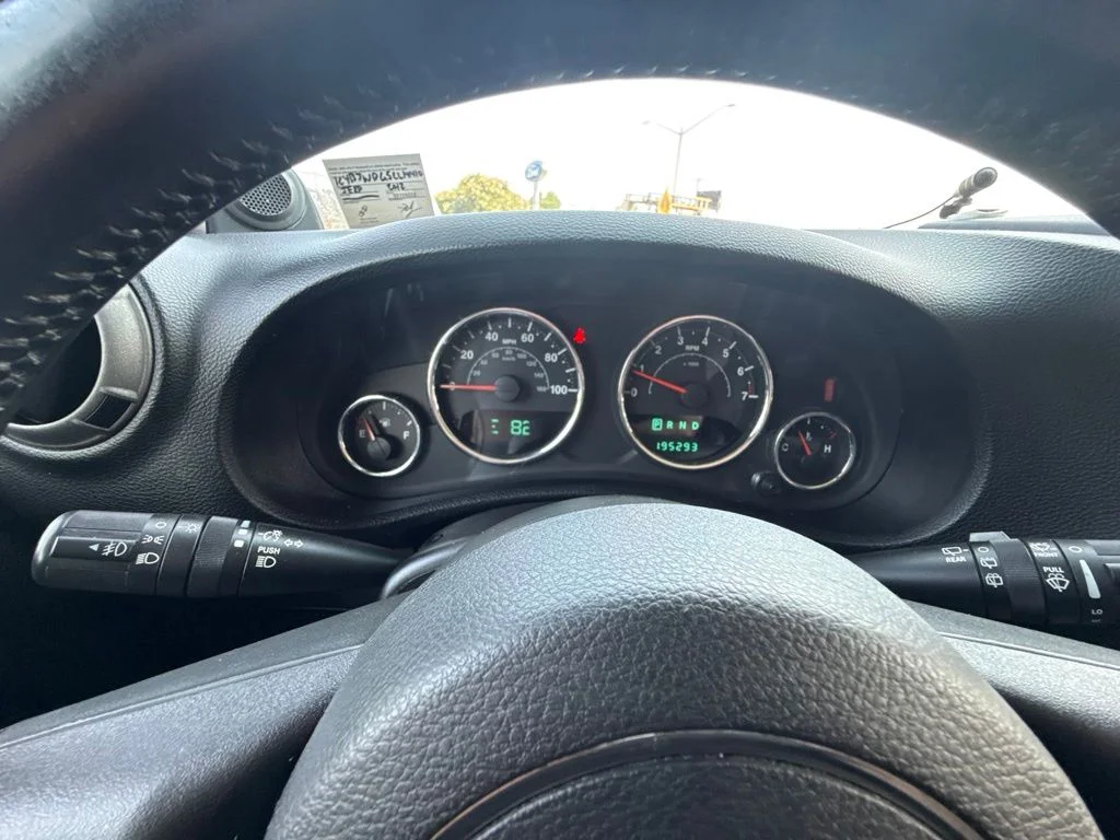 Used 2012 Black Jeep Unlimited Sport image 19