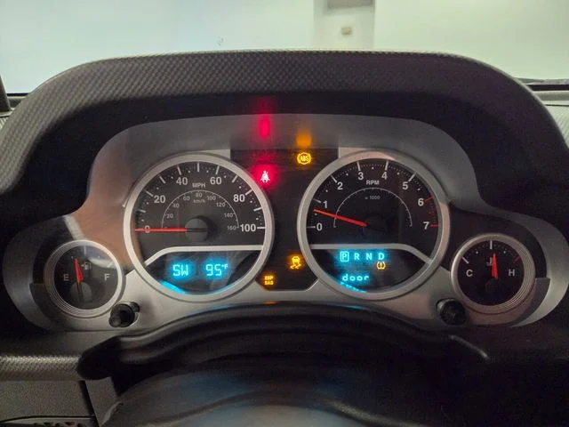 Used 2009 Orange Jeep Unlimited Sahara image 22