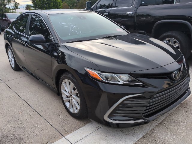 Used 2023 Midnight Black Metallic Toyota LE image 1