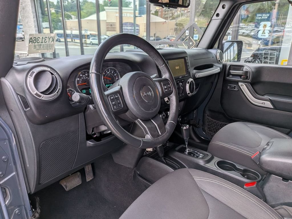Used 2016 Black Jeep Unlimited Sahara image 12
