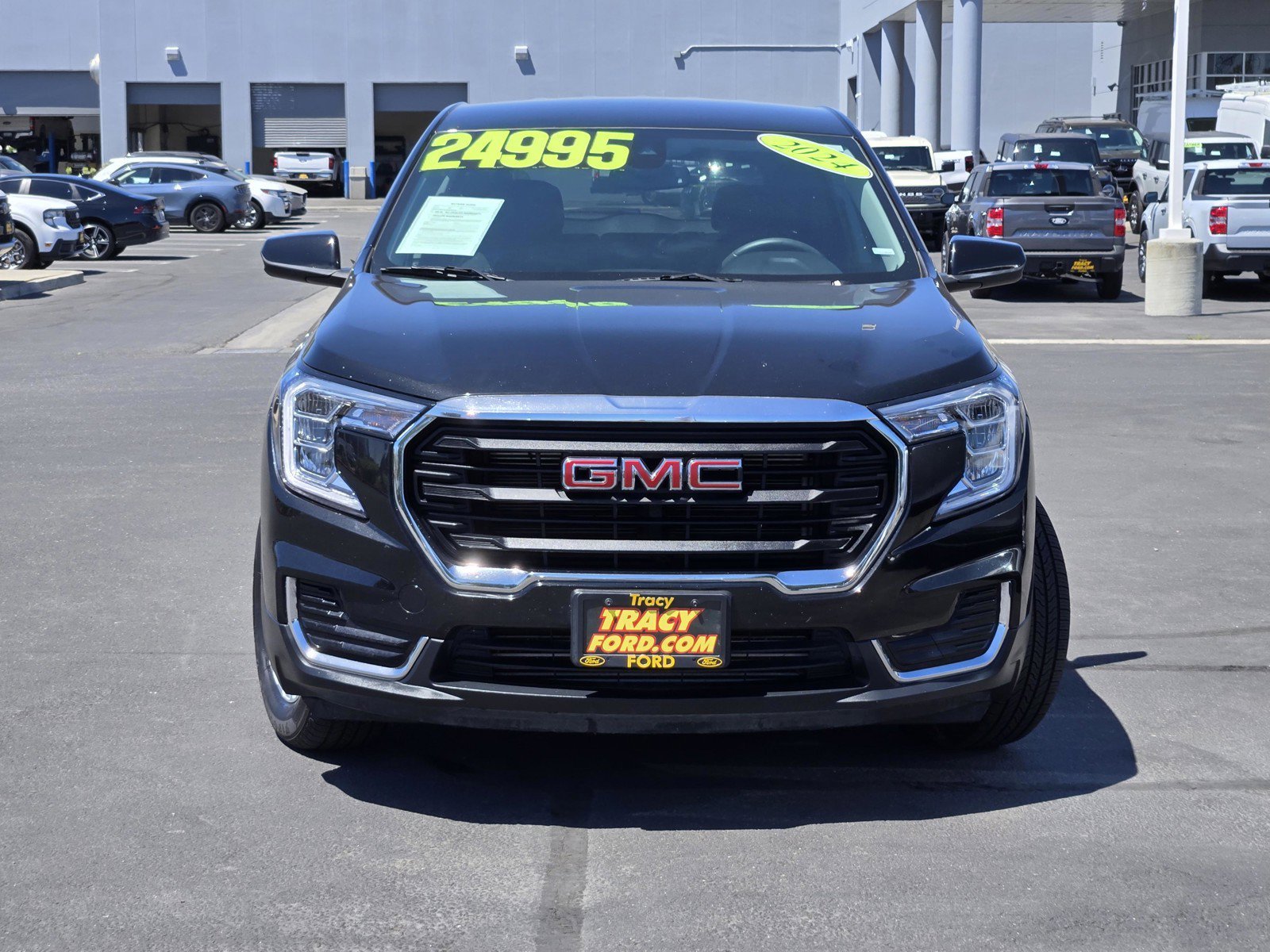Used 2024 Ebony Twilight Metallic GMC SLE image 2