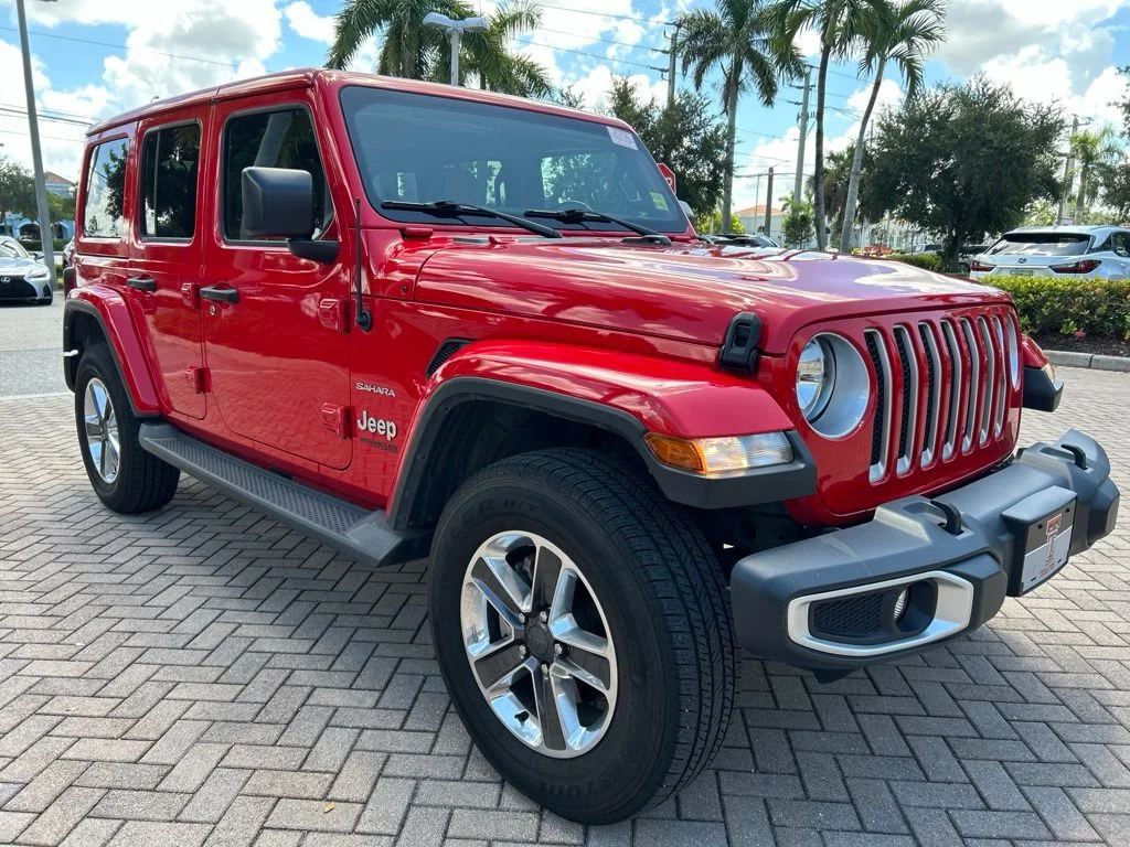 Used 2021 Red Jeep Unlimited Sahara image 1