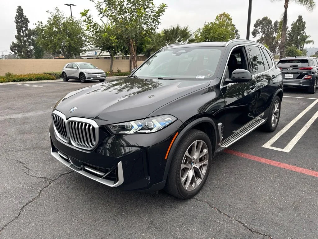 Used 2024 Black BMW sDrive40i image 1