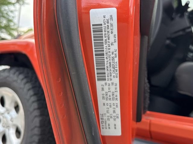 Used 2015 Orange Jeep Sahara image 30