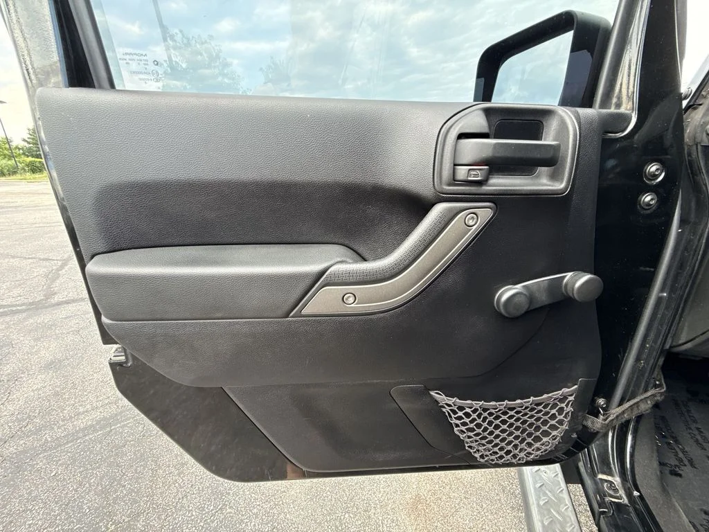 Used 2013 Black Jeep Unlimited Sport image 13