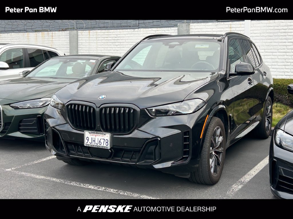 Certified Used 2024 Black Sapphire Metallic BMW xDrive40i image 1