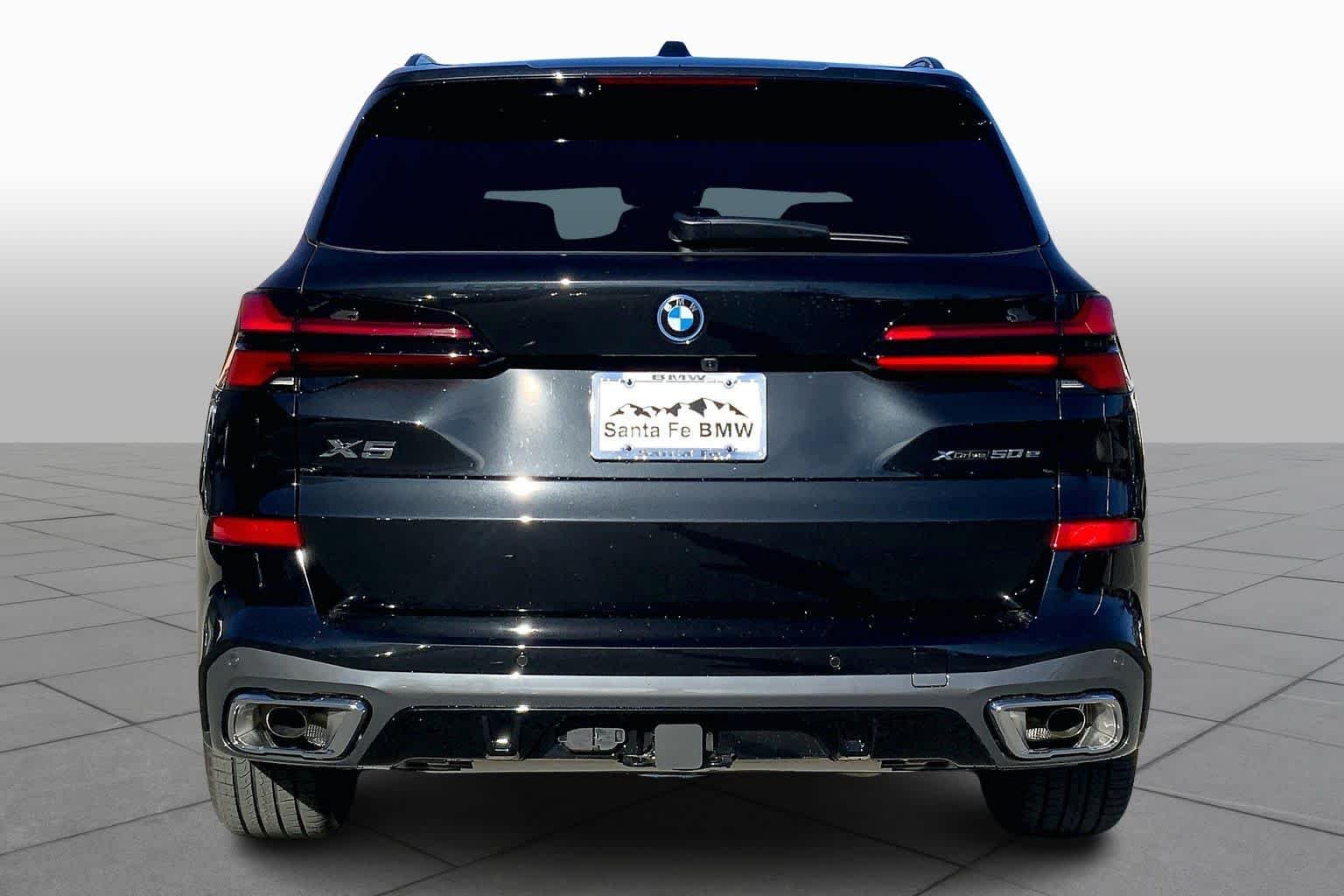 New 2026 Black Sapphire Metallic BMW xDrive50e image 4