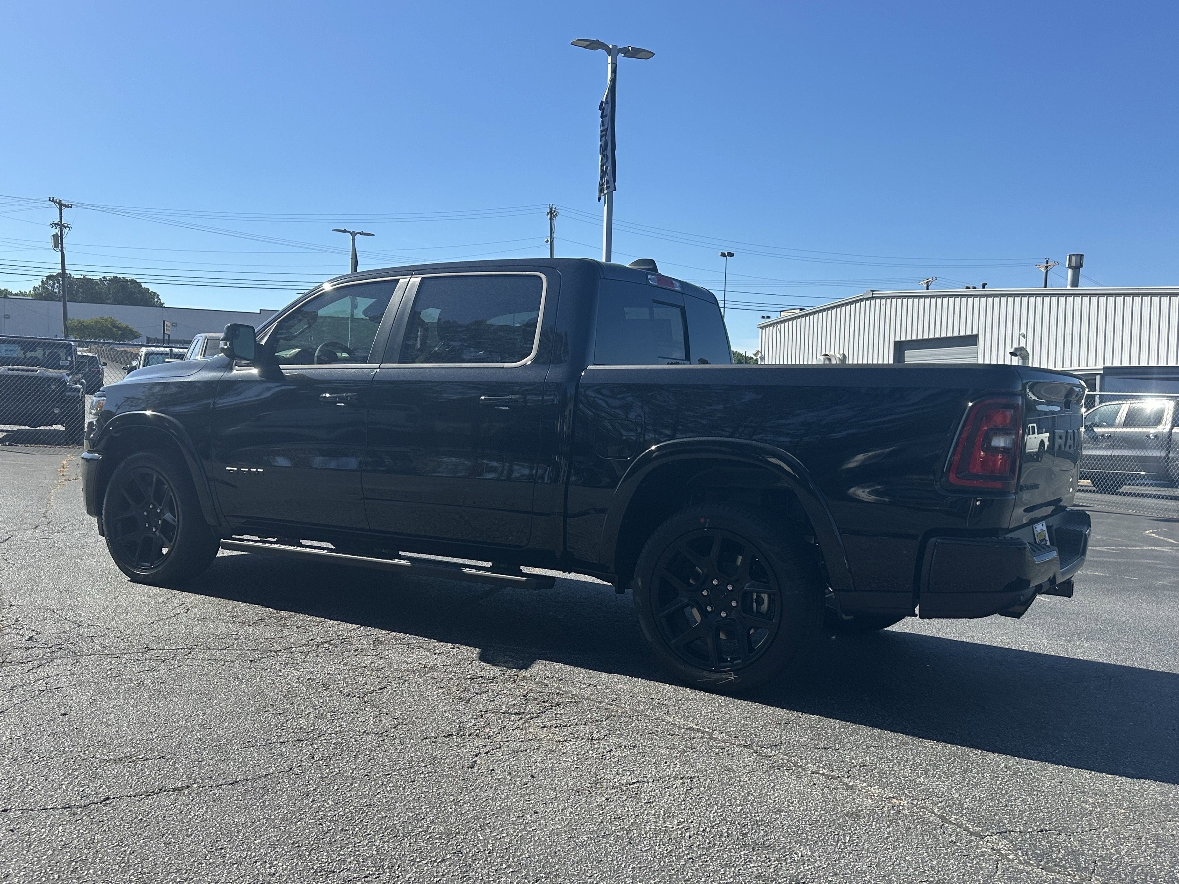 New 2026 Diamond Black Crystal Pearl-Coat Exterior Paint RAM Laramie image 6