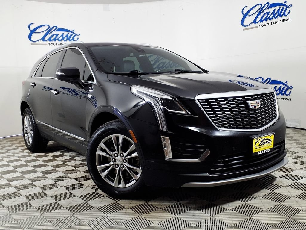 Used 2021 STELLAR BLACK METALLIC Cadillac FWD Premium Luxury image 1