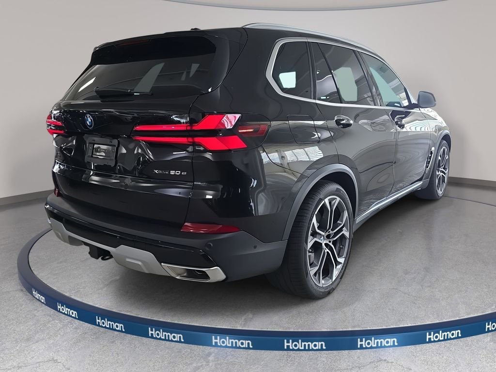 New 2026 Black Sapphire Metallic BMW xDrive50e image 4