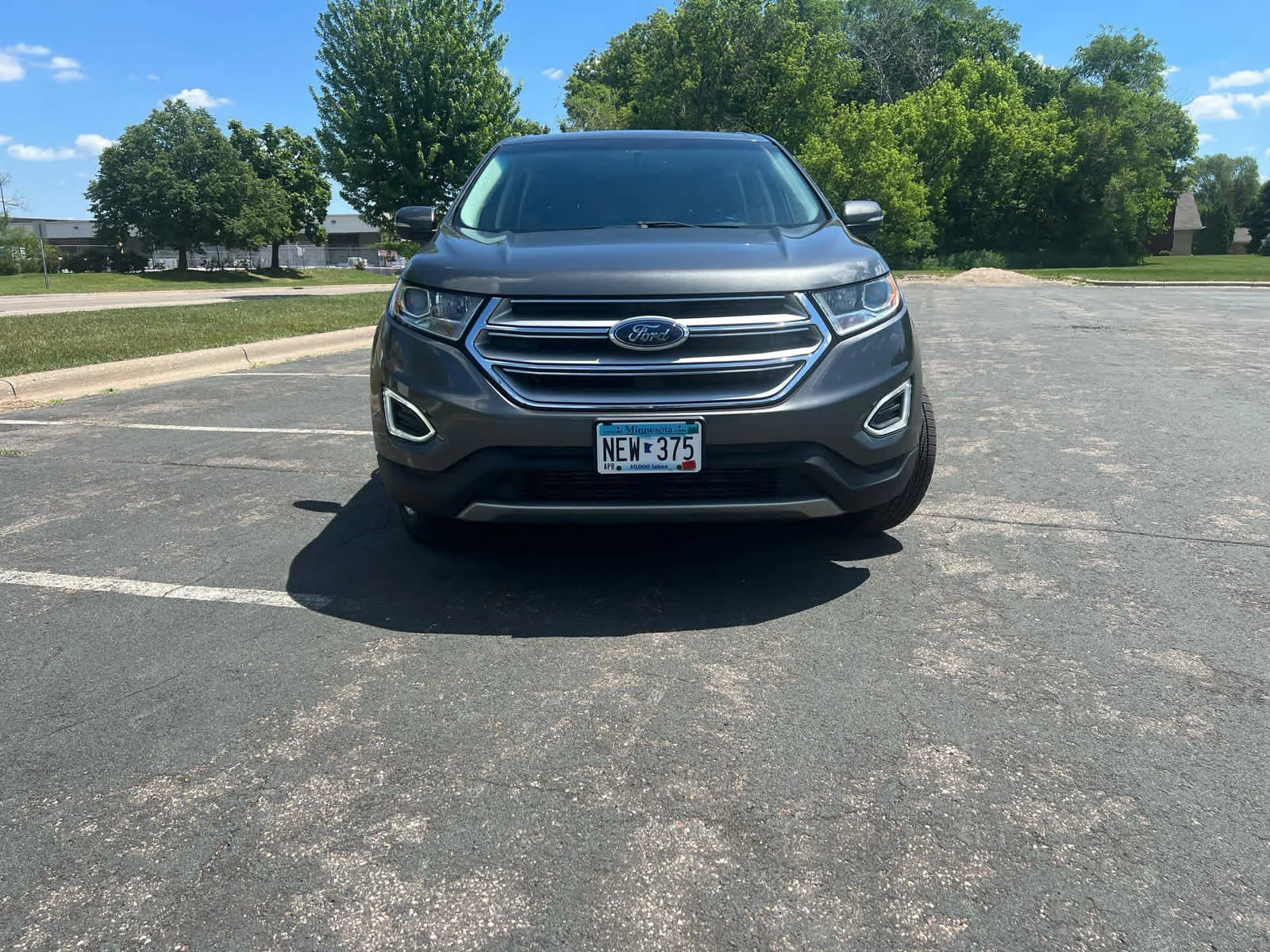 Used 2015 Magnetic Metallic Ford SEL image 2