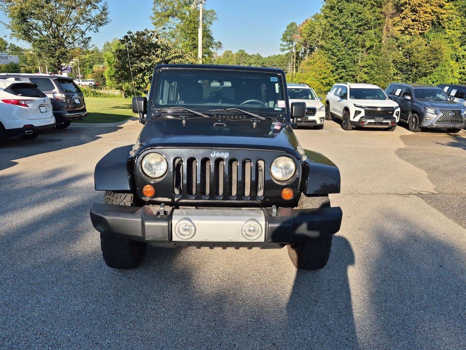 Used 2011 Black Clear Coat Jeep Sahara image 7