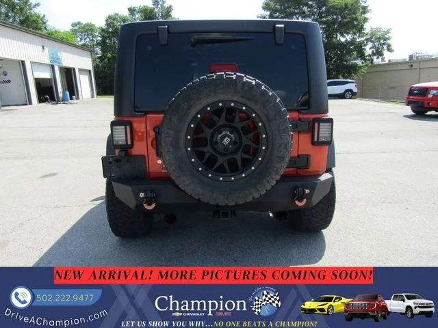Used 2015 Orange Jeep Unlimited Sport image 6