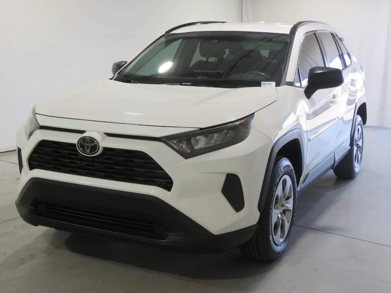 Used 2019 Super White Toyota LE image 1