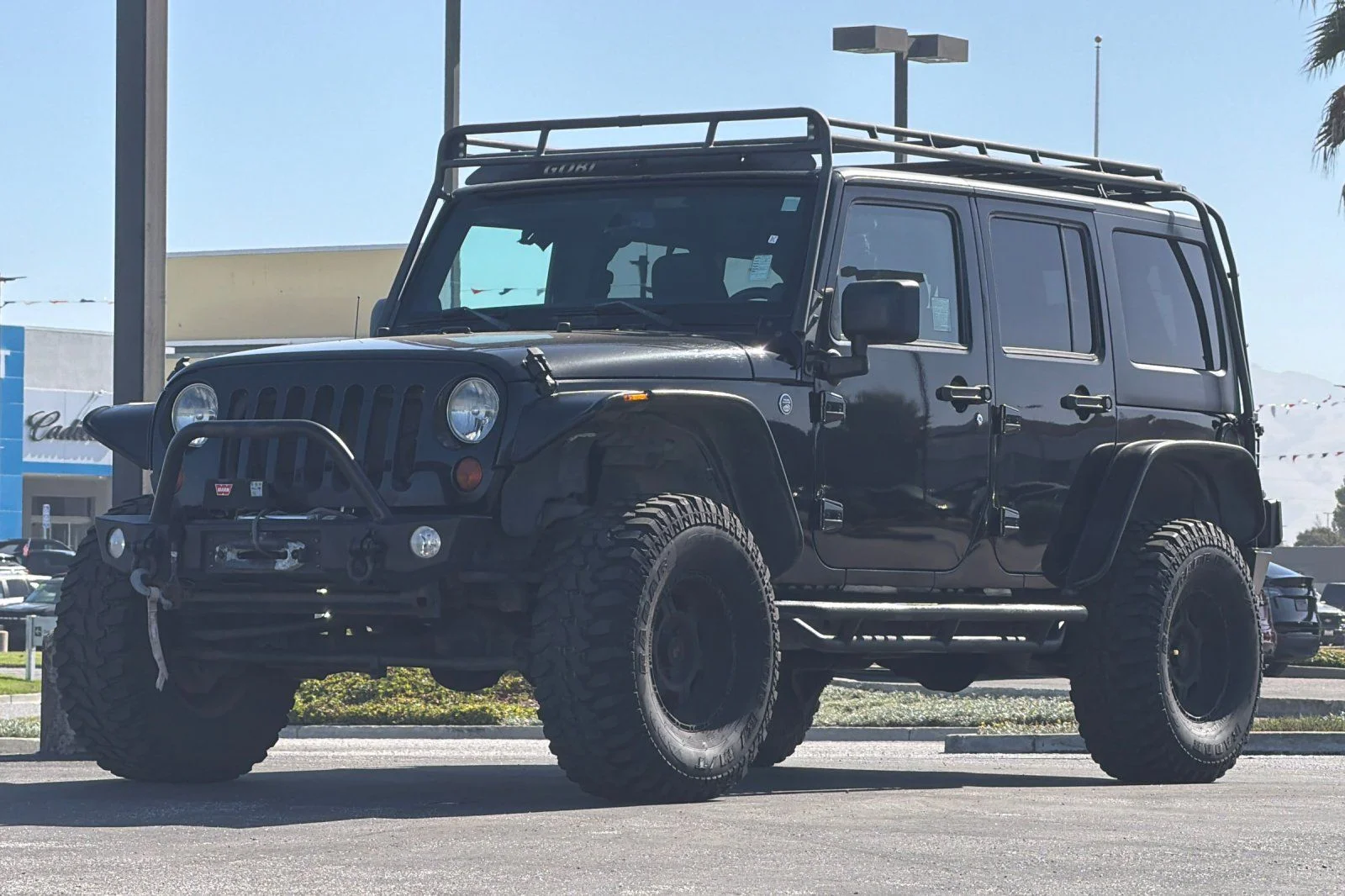 Used 2013 Black Jeep Unlimited Sport image 9