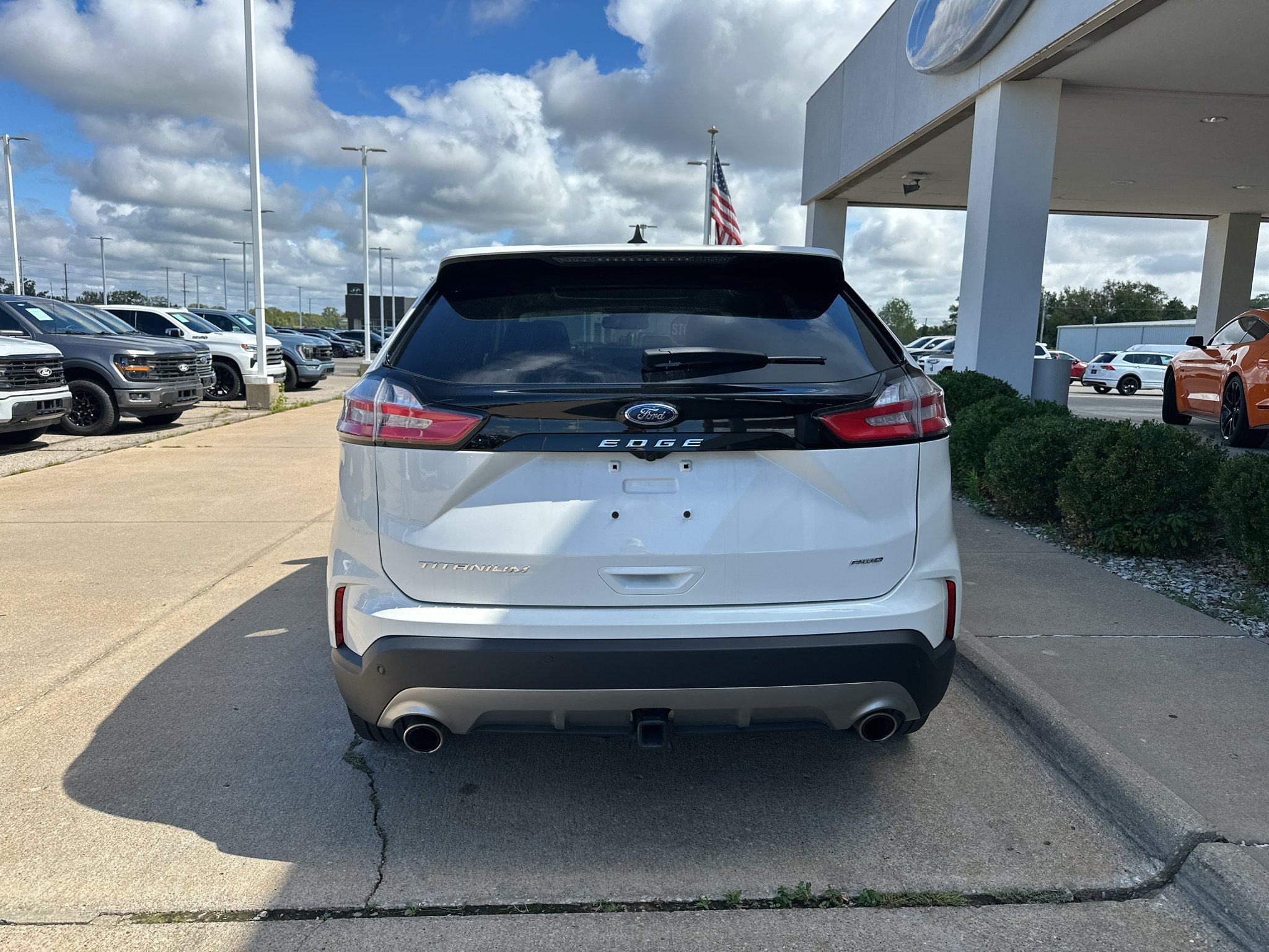 Used 2024 Star White Metallic Tri-Coat Ford Titanium image 14