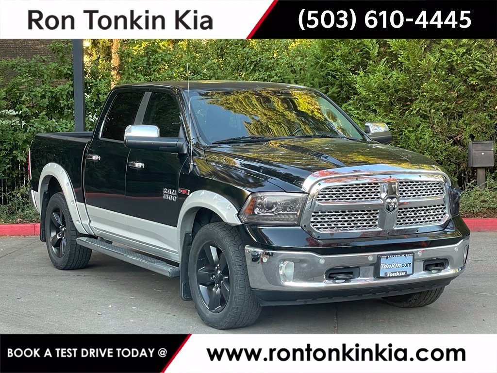 Used 2015 Black Forest Green Pearlcoat Ram Laramie image 1