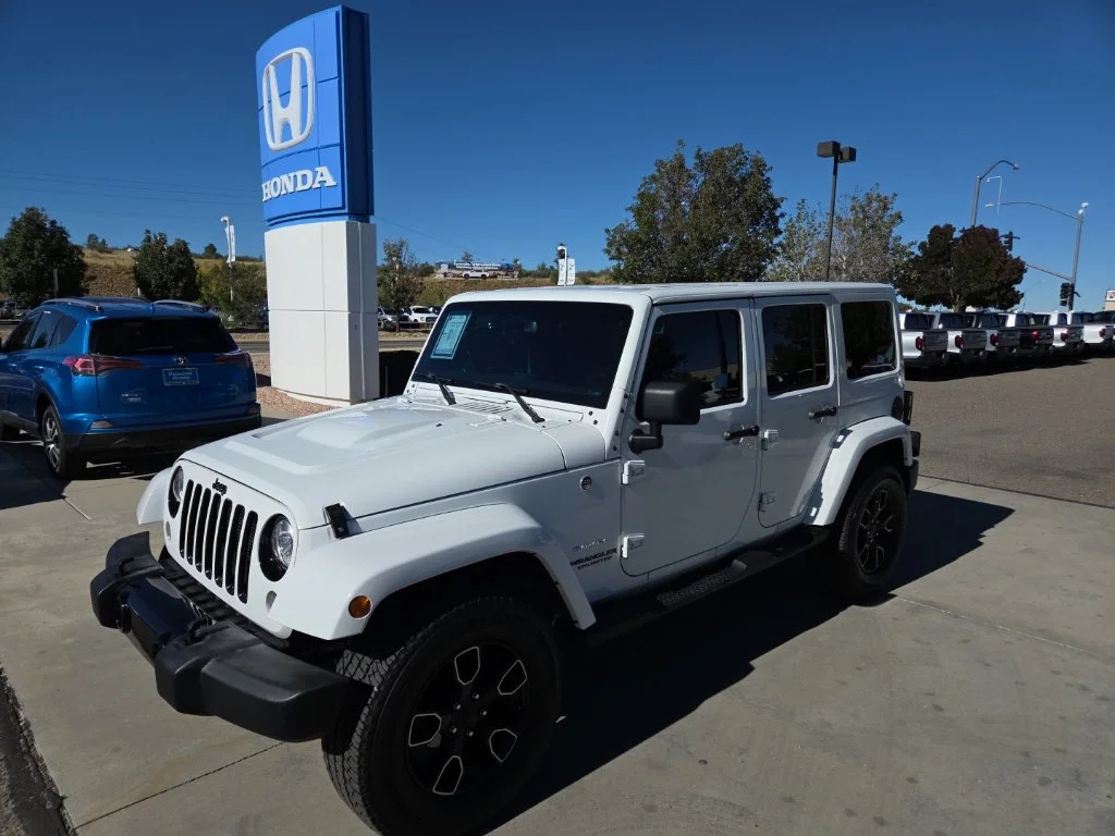 Used 2017 White Jeep Unlimited Sahara image 1