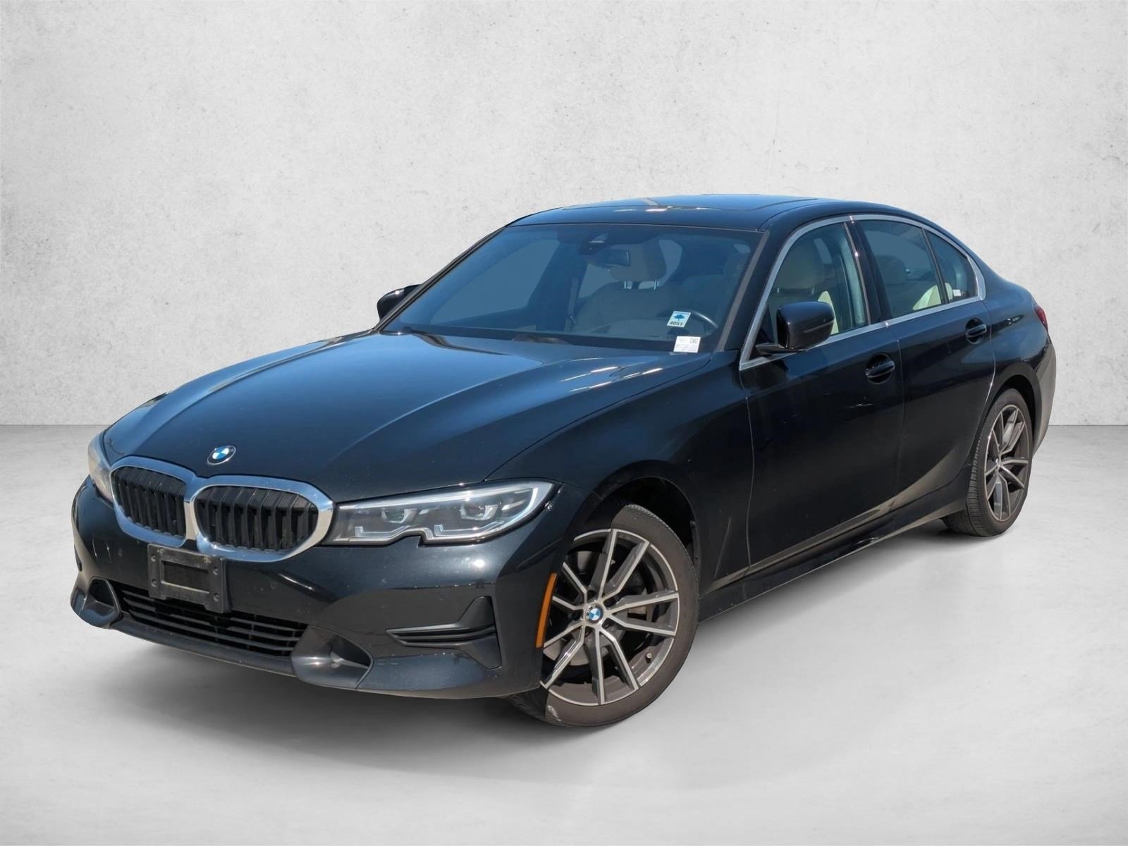 Used 2021 Black Sapphire Metallic BMW 330i xDrive image 1