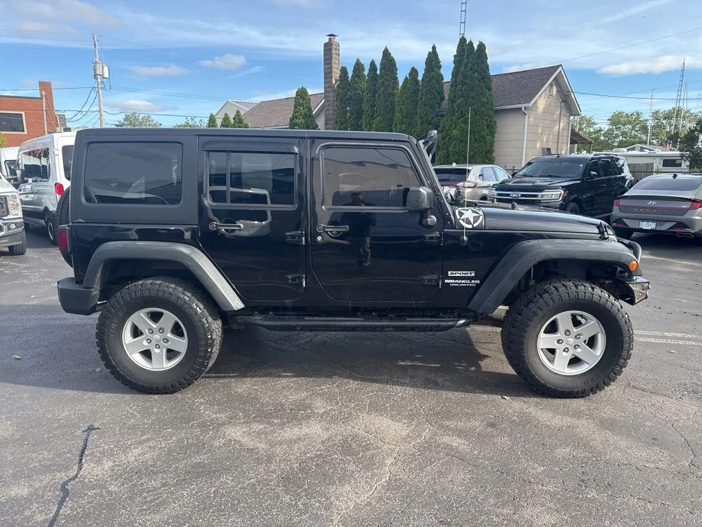 Used 2014 Jeep Wrangler Unlimited Sport with VIN 1C4BJWDG3EL299814 for sale in Huron, OH