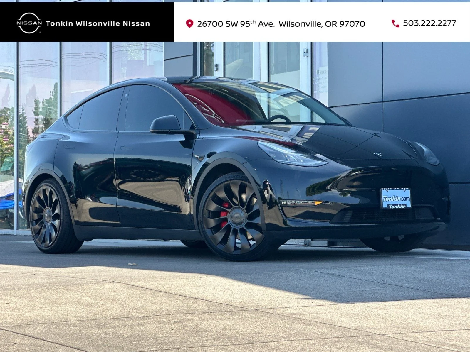 Used 2022 Solid Black Tesla Performance image 1
