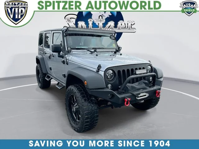 Used 2015 Silver Jeep Unlimited Sport image 1