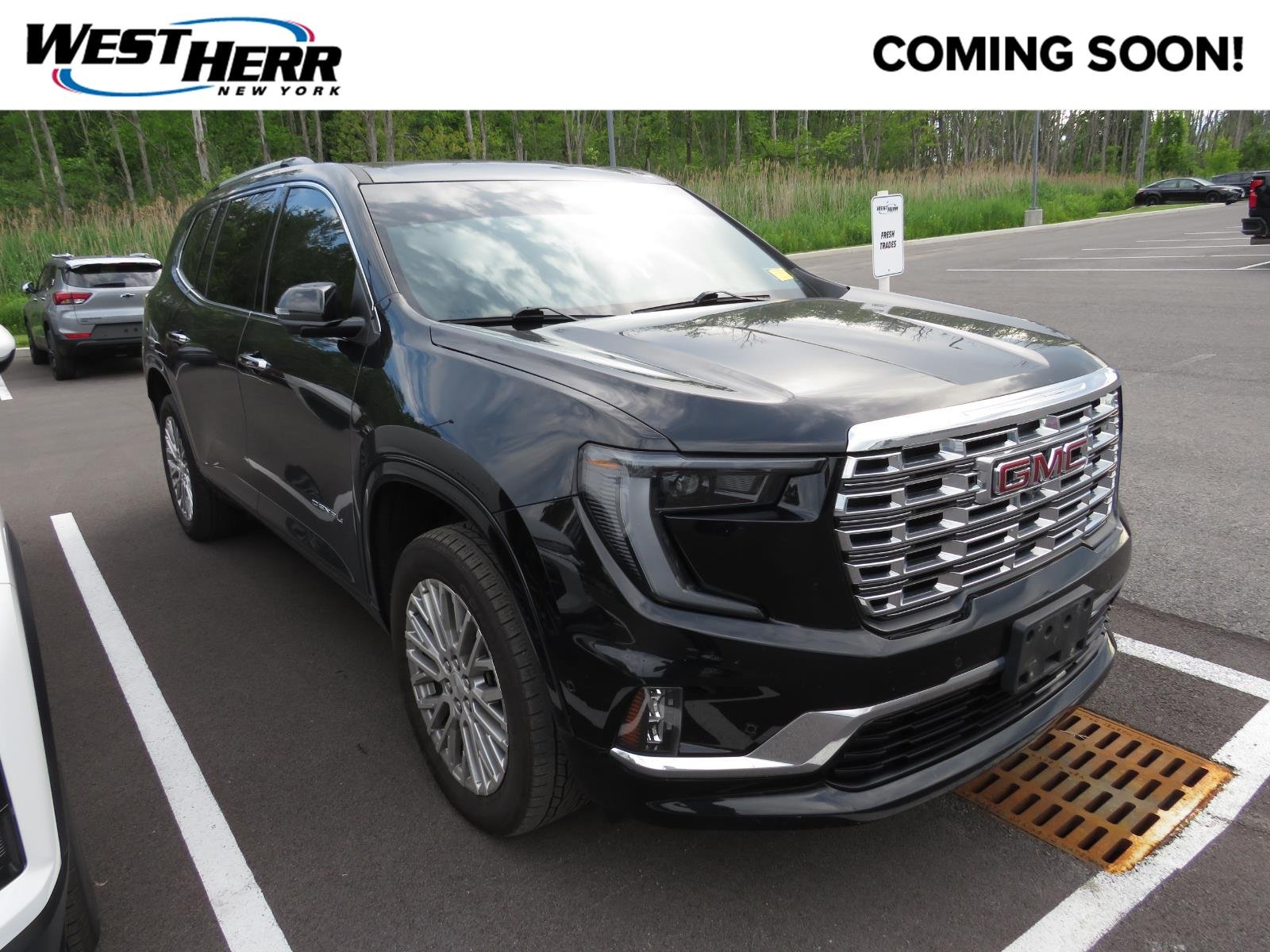 Used 2024 EBONY TWILIGHT METALLIC GMC  image 1