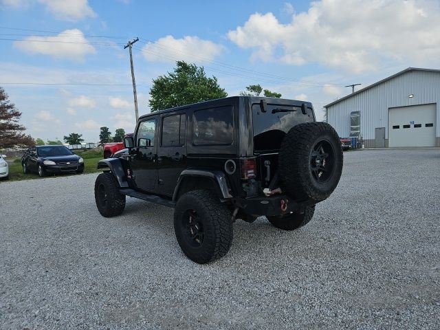 Used 2013 Black Jeep Unlimited Sahara image 8