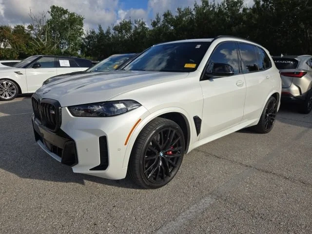 Used 2025 Mineral White Metallic BMW M60i image 1