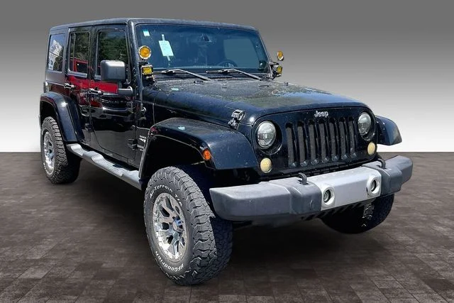 Used 2014 Jeep Wrangler Unlimited Sahara with VIN 1C4BJWEG7EL132211 for sale in Farmington, NM