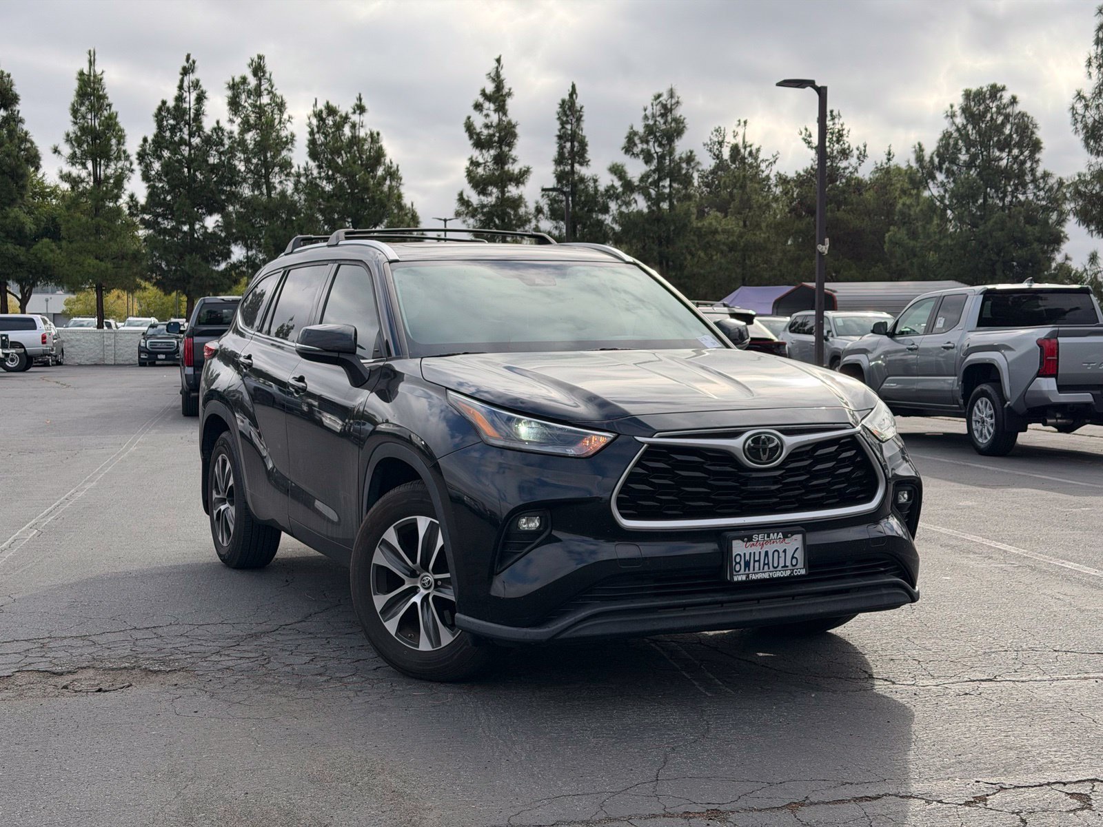 Used 2021 Midnight Black Metallic Toyota XLE image 1