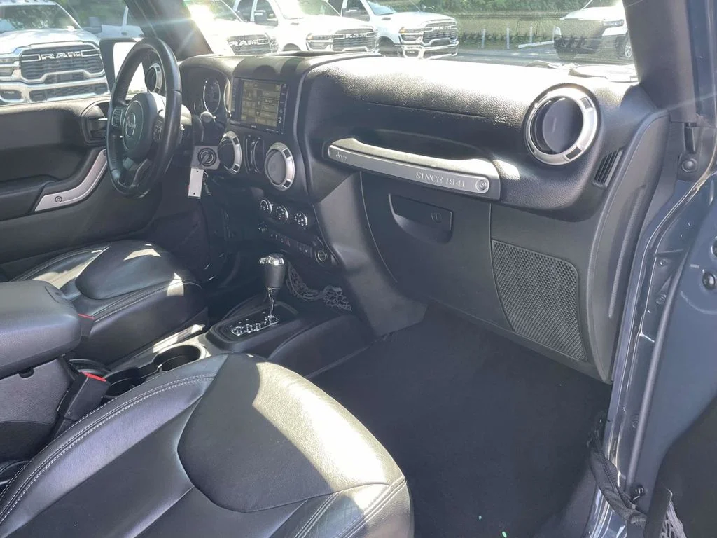 Used 2016 Black Jeep Unlimited Sahara image 14