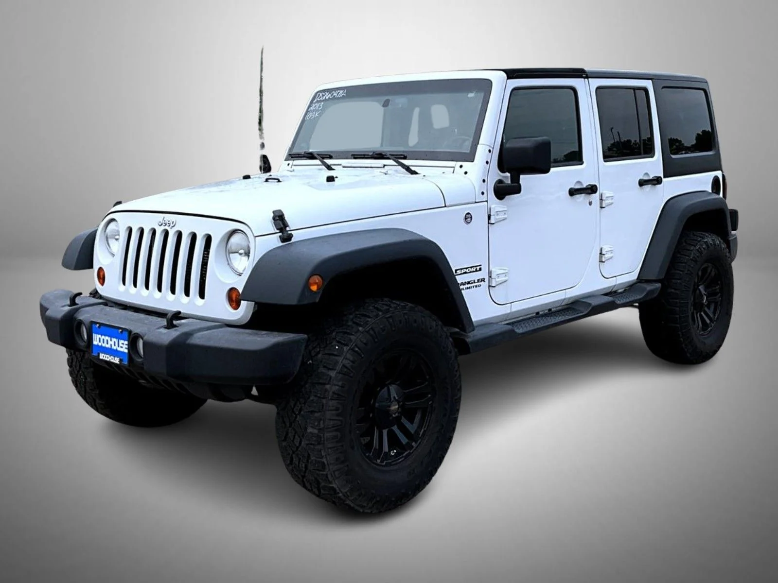 Used 2013 White Jeep Unlimited Sport image 1