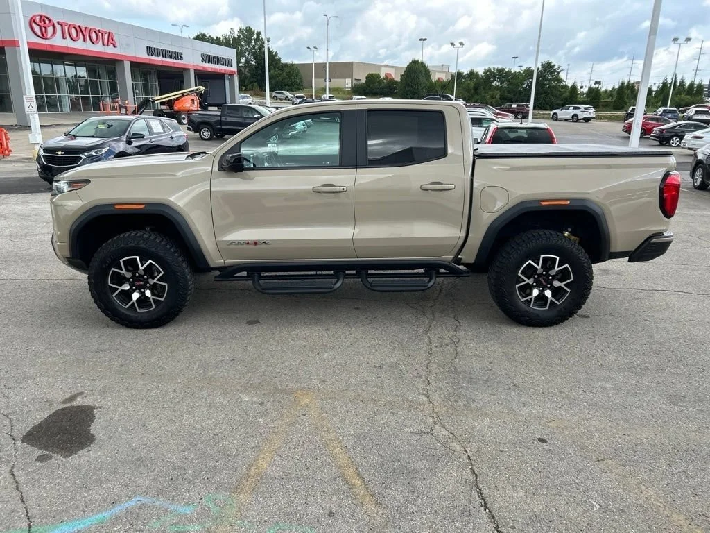 Used 2023 Desert Sand Metallic GMC AT4X image 8