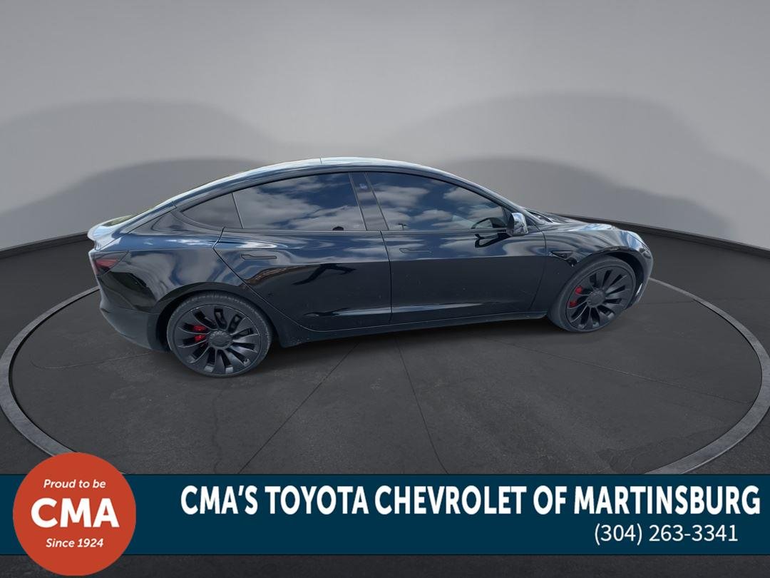Used 2022 Solid Black Tesla Performance image 9