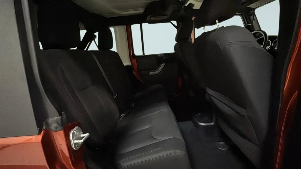 Used 2014 Orange Jeep Unlimited Sport image 15