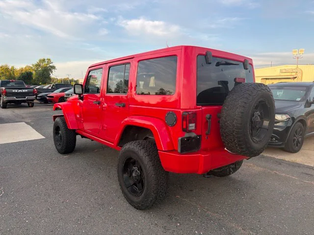 Used 2015 Red Jeep Unlimited Sahara image 9